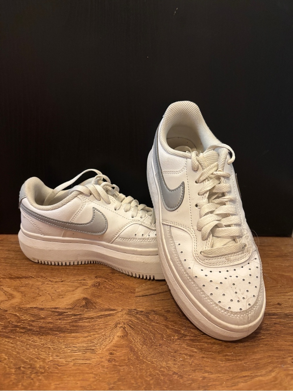 Nike White Sneakers with Silver Swoosh